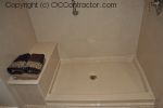 A Bathroom with Staron Countertop Shower with Bench Seat Custom Dark Oak Cabinetry Vinyl Flooring (14) sm