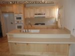 Kitchen with Light Maple Cabinetry and Staron Countertops sm